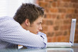 Photo: Man studying laptop in modern office Man studying laptop in modern office