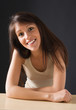 Portrait of a smiling isolated young female student.