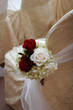 Wedding flowers in a church at the end of the pew