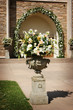 an image of flower with the church doors before a wedding