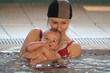 Mother with small baby in the water Mother with small baby in the water
