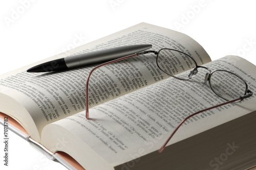 Photo: Book pencil and glass Book pencil and glass