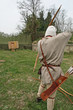 a medieval archer acting during an italian fair
