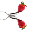 Fragola e cucchiaio riflessi