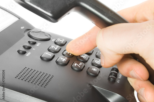 Foto: dialing on phone dialing on phone