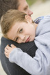 Son giving Father cuddle