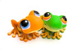 Two frog toys isolated on white background