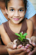 Girl Holding Plant