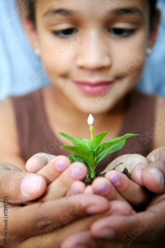 Girl Holding Plant