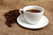 white cup of coffee on brown sack