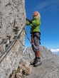 woman climbing on ferrata 1