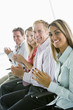 Photo: Group of four businesspeople applauding Group of four businesspeople applauding