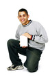 Isolated young man displaying blank DVD case