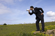 Businessman speaking with a megaphone