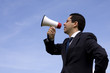 Businessman speaking with a megaphone