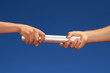 hands giving baton hands giving baton