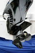 The new black screw motor for a white boat