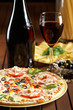 still life with red wine and pizza still life with red wine and pizza