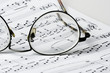 glasses on sheet music