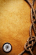 Rope and compass on old paper