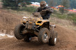 Photo: Yellow quad riding in the mud Yellow quad riding in the mud