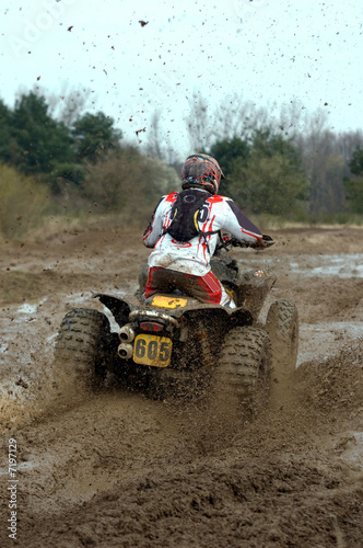 Photo: big yellow quad going through a deep mud big yellow quad going through a deep mud