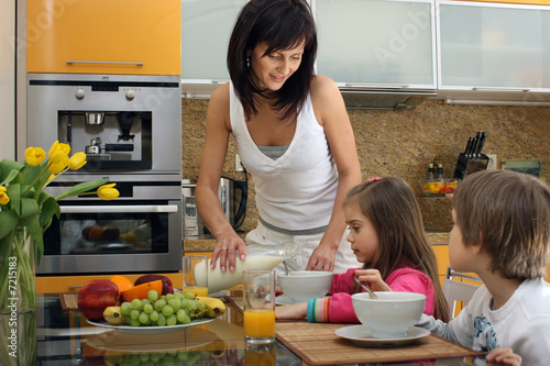 Photo: Beautiful mother serving breakfast 2 Beautiful mother serving breakfast 2