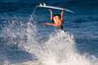 Surfer inverted 180 degrees off of a wave