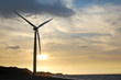 single wind turbine at sunset