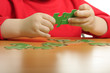 Hands assembling puzzle Hands assembling puzzle