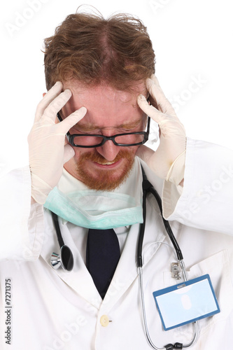Photo: doctor having headache doctor having headache