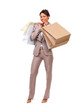 Full body portrait of a businesswoman holding shopping bags. 