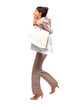 Business woman running with shopping bags