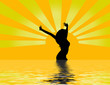woman at sunrise with water