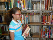 Girl in Library Stacks