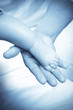 Baby foot and adult hand