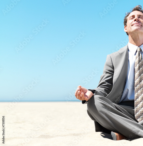 Photo: Business man meditating Business man meditating