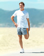 Senior man exercising on the beach