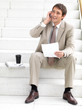 Happy business man talking on cellphone