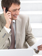 Happy business man talking on cellphone