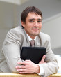 Happy business man holding folder