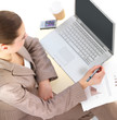 Businesswoman working by laptop