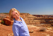 Beautiful woman smiling while standing on a mountain