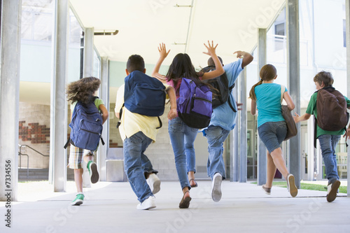 Photo: Elementary school pupils running outside Elementary school pupils running outside