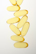 Yellow pills on white background Yellow pills on white background