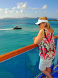 Middle-aged woman on a cruise ship balcony