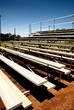 empty bleachers with no people at a baseball game.