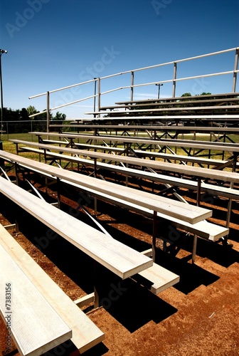 Photo: empty bleachers with no people at a baseball game. empty bleachers with no people at a baseball game.