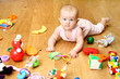 baby playing with a toy (girl 6 month)