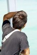 young man looking at the sky. body language young man looking at the sky. body language